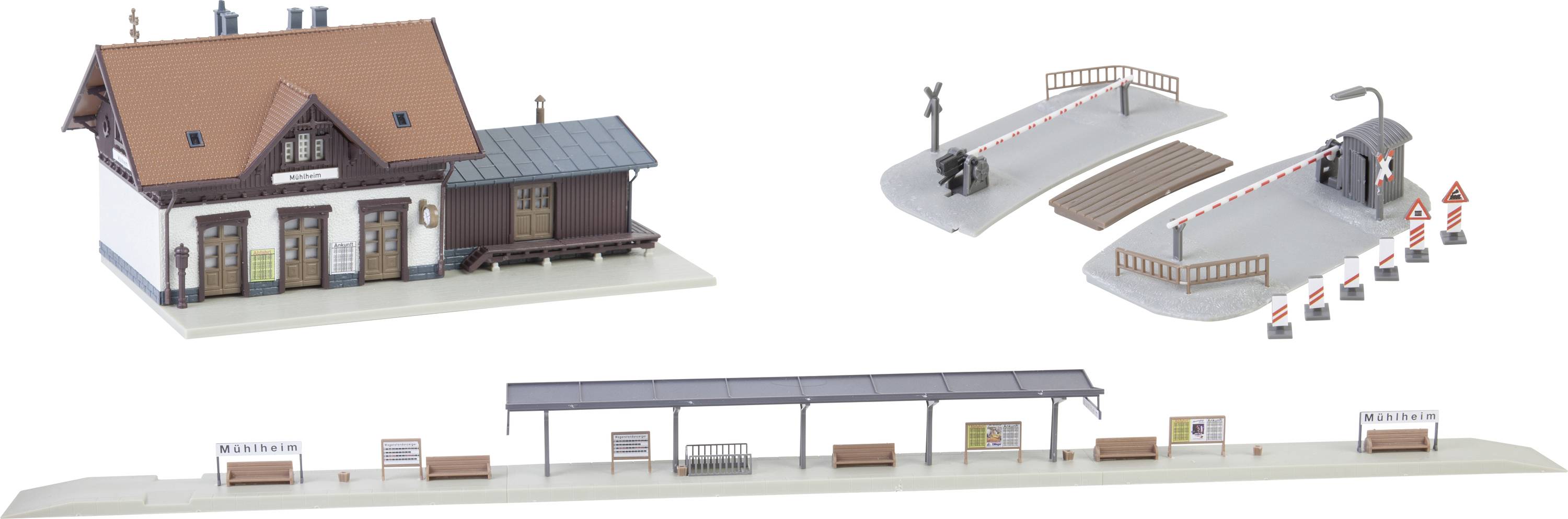 Model Railway Accessories: A station building with a red roof, two level crossings with barriers, and a covered platform scene.