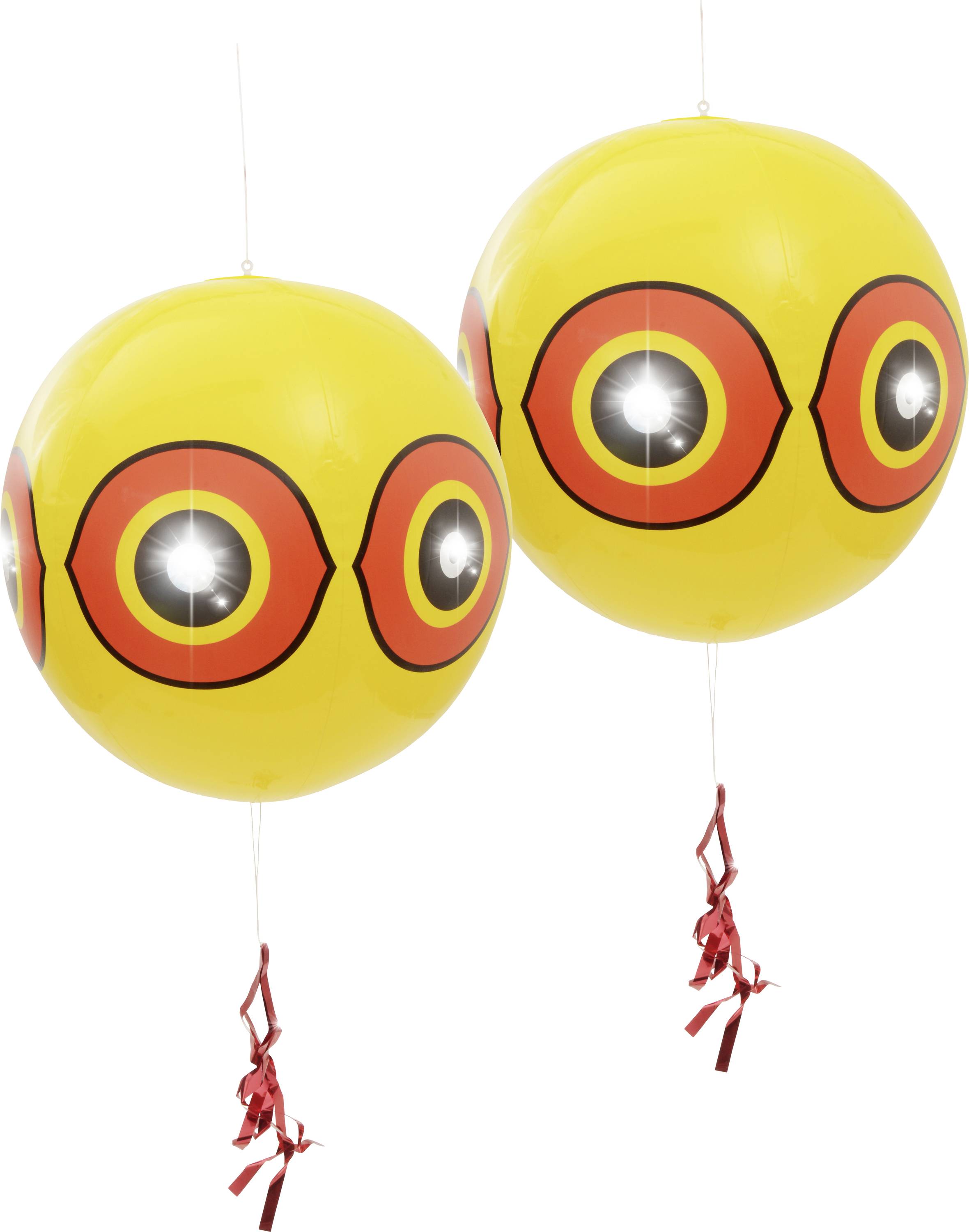 Two yellow balloons with red, circular patterns and red ribbons hang side by side.