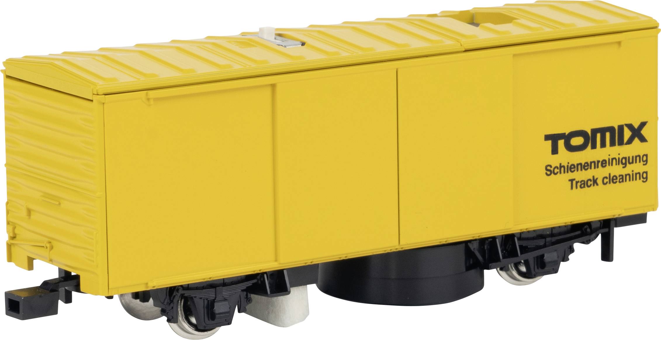 Yellow model railway track cleaning wagon with the inscription 'Tomix Track Cleaning', for cleaning model railway tracks.