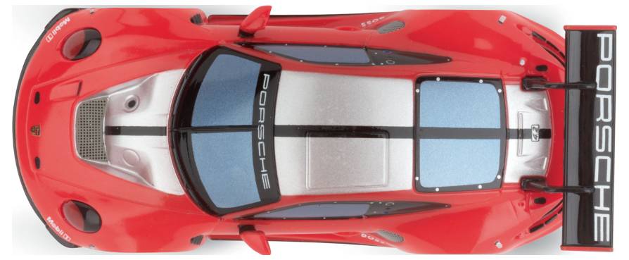 Red racing car viewed from above with black and blue accents. Rear spoiler featuring 'Porsche' inscription.