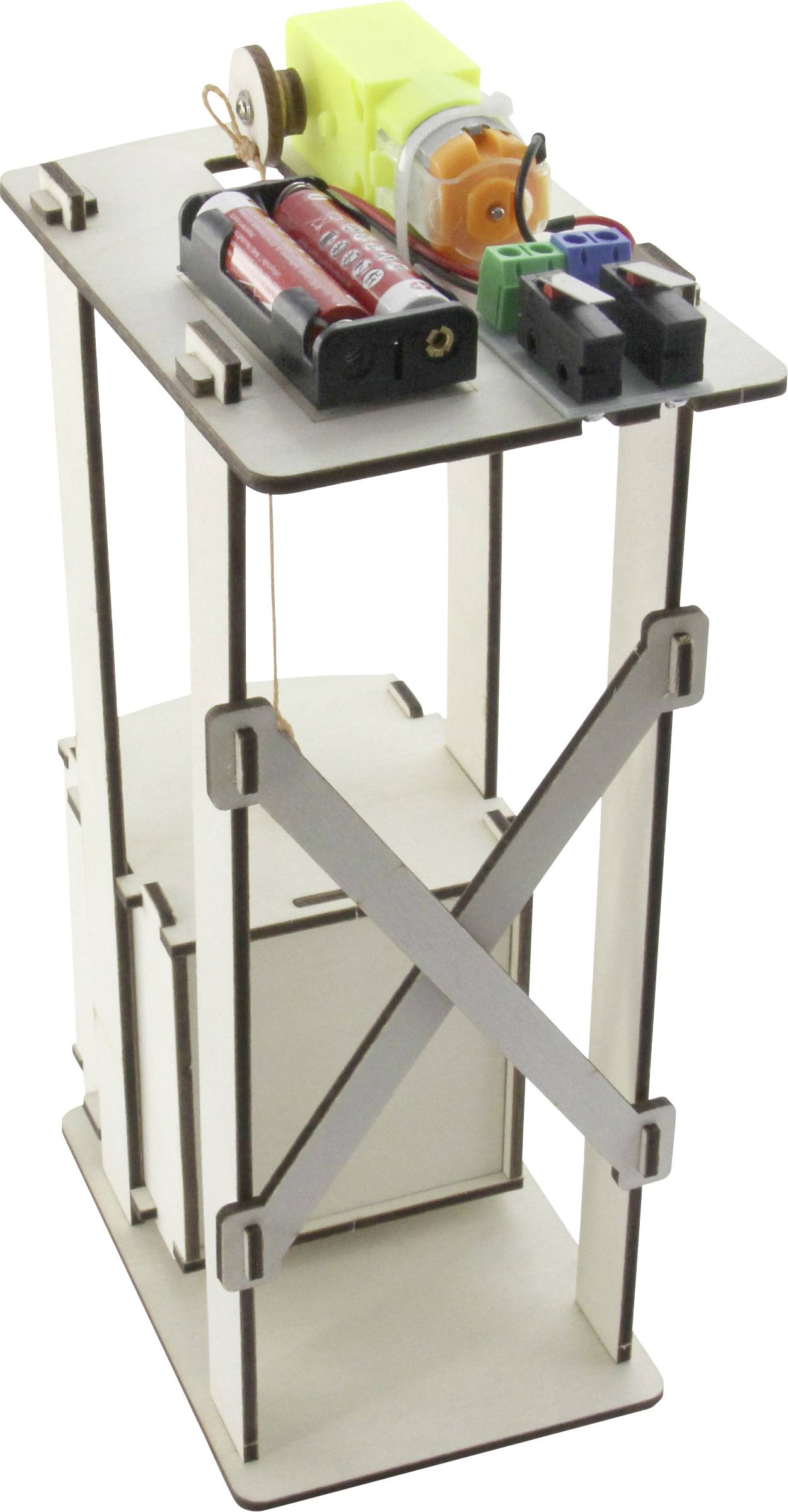 A wooden model lift with visible gears, batteries, and electronic components demonstrates a simple mechanical construction.