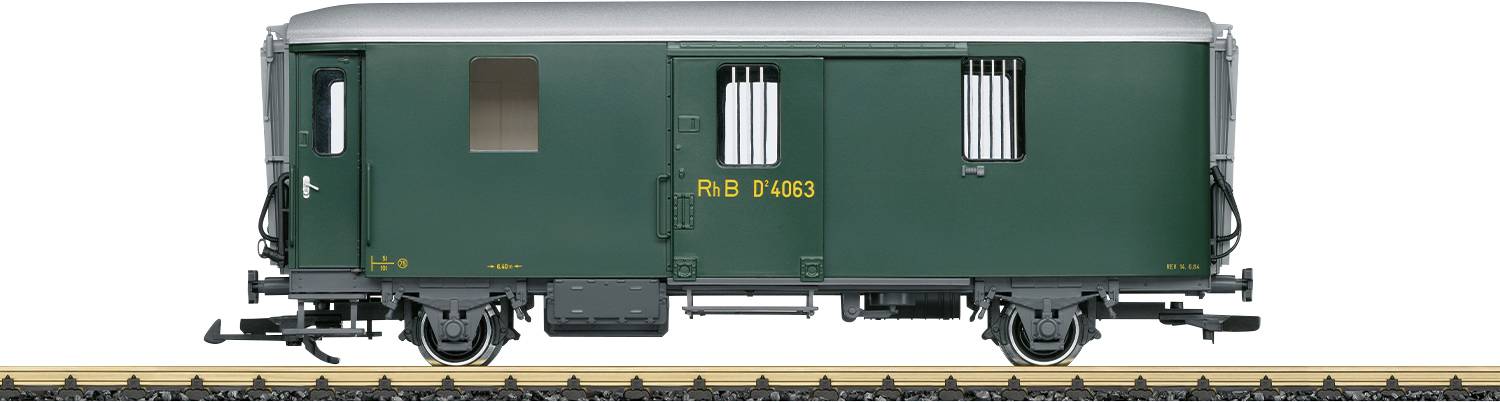 Green goods wagon on railway track, viewed from the side.