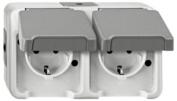 Double socket with grey protective covers, suitable for outdoor use. Robust and weatherproof for safe use outdoors.