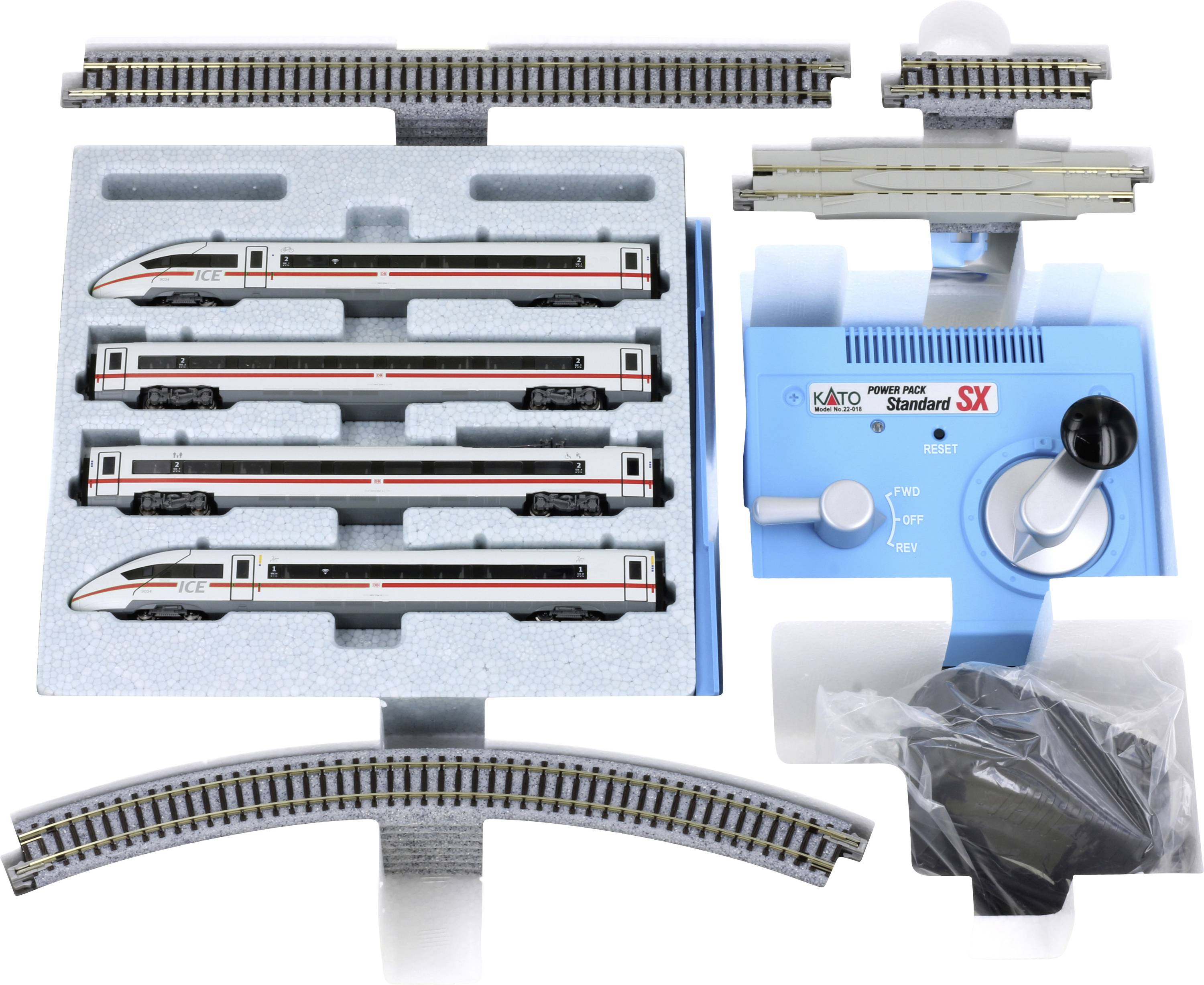 Railway model set with four ICE trains in foam insert, control unit with rotary knob and accessories. Track pieces top and bottom.