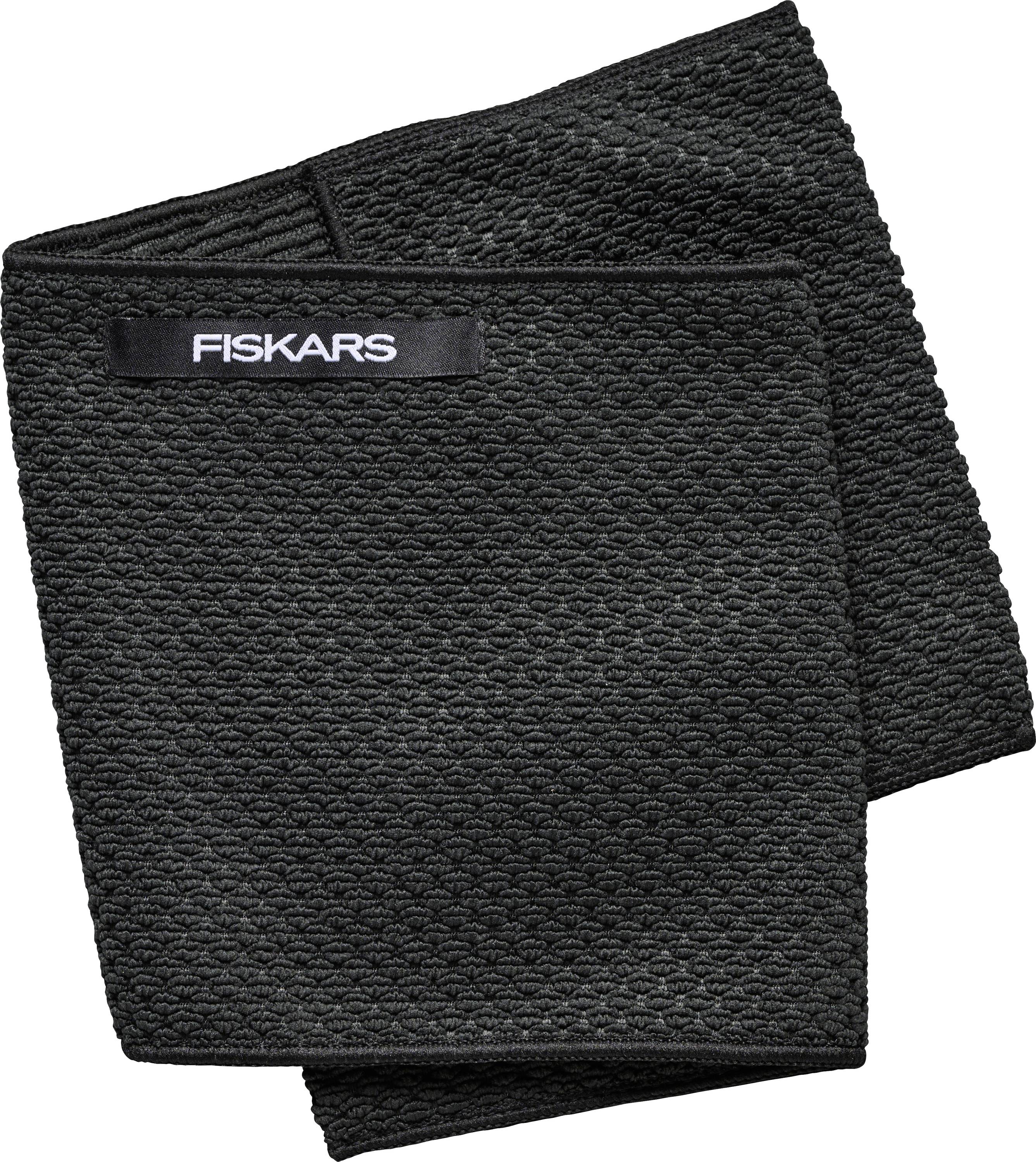 A black, textured tea towel with a 'Fiskars' label at the top.