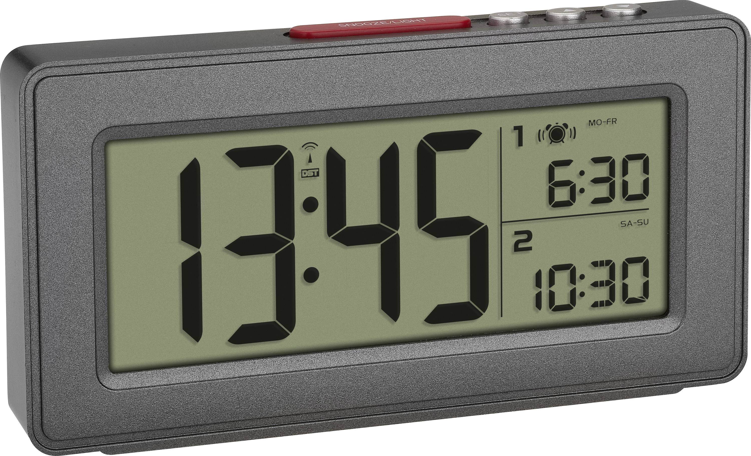 Black digital alarm clock with large display. Shows 1:45 PM. Bottom right shows alarm times 6:30 AM (Mon-Fri) and 10:30 AM (Sat-Sun).