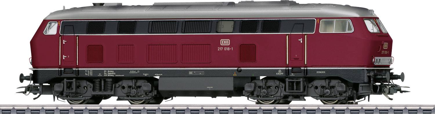 A red diesel locomotive from Deutsche Bahn is standing on a track. It has a silver top and black wheels.