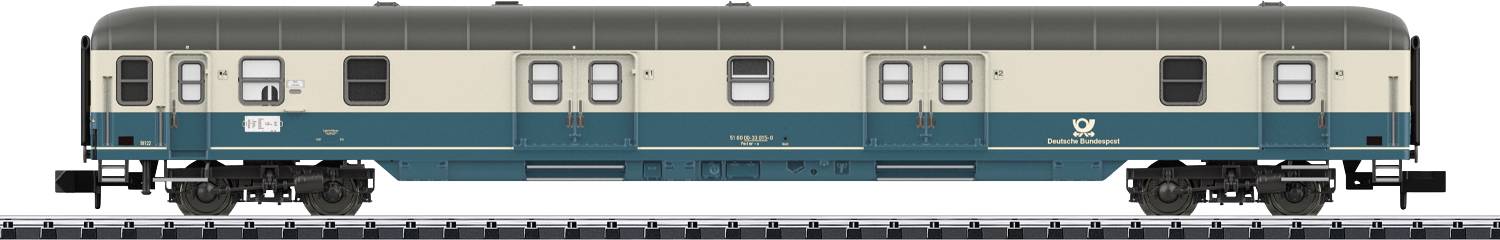 A two-tone model railway carriage, partly beige, partly turquoise. It displays numerous windows and detailed chassis.
