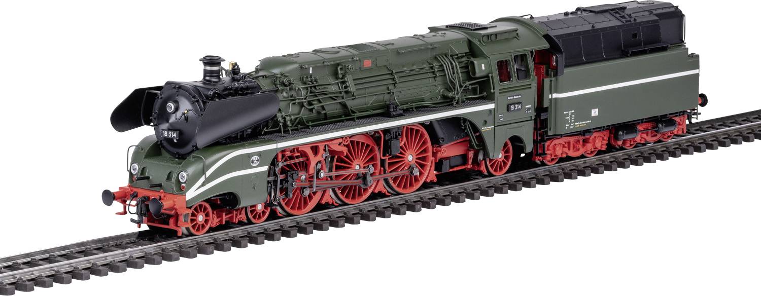 Green steam locomotive with red wheels on railway tracks, viewed from the side. Classic design and detailed machine components.
