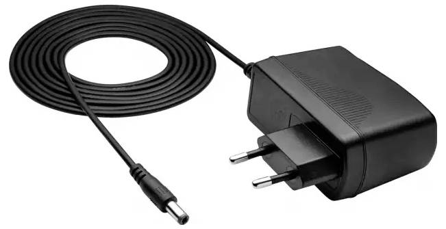 Black power adapter with plugs, connected to a long cable. Wall plug and round DC output connector visible.