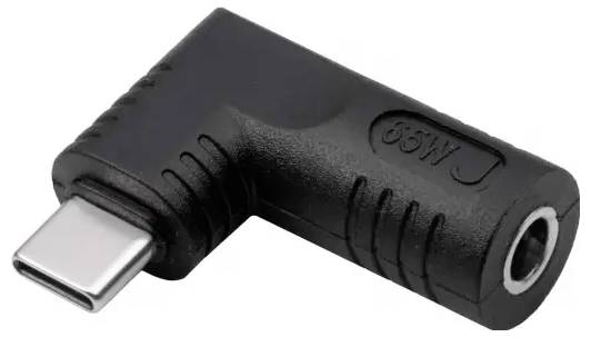 A black L-shaped adapter with a USB-C connector on one side and a 3.5mm headphone jack on the other side.