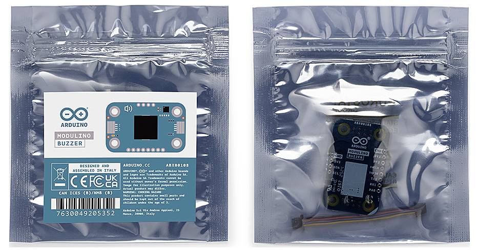 Two silver packaging containers with electronic modules and Arduino brand stickers. On the left, a module with a blue label is visible.