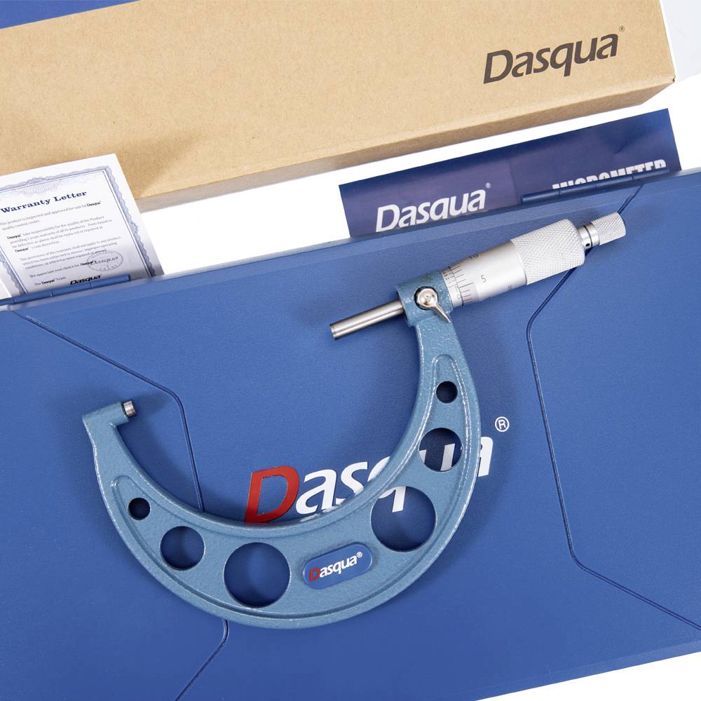 A blue micrometer with a metallic finish placed on a blue Dasqua box, along with a brown box and a warranty letter partially visible.