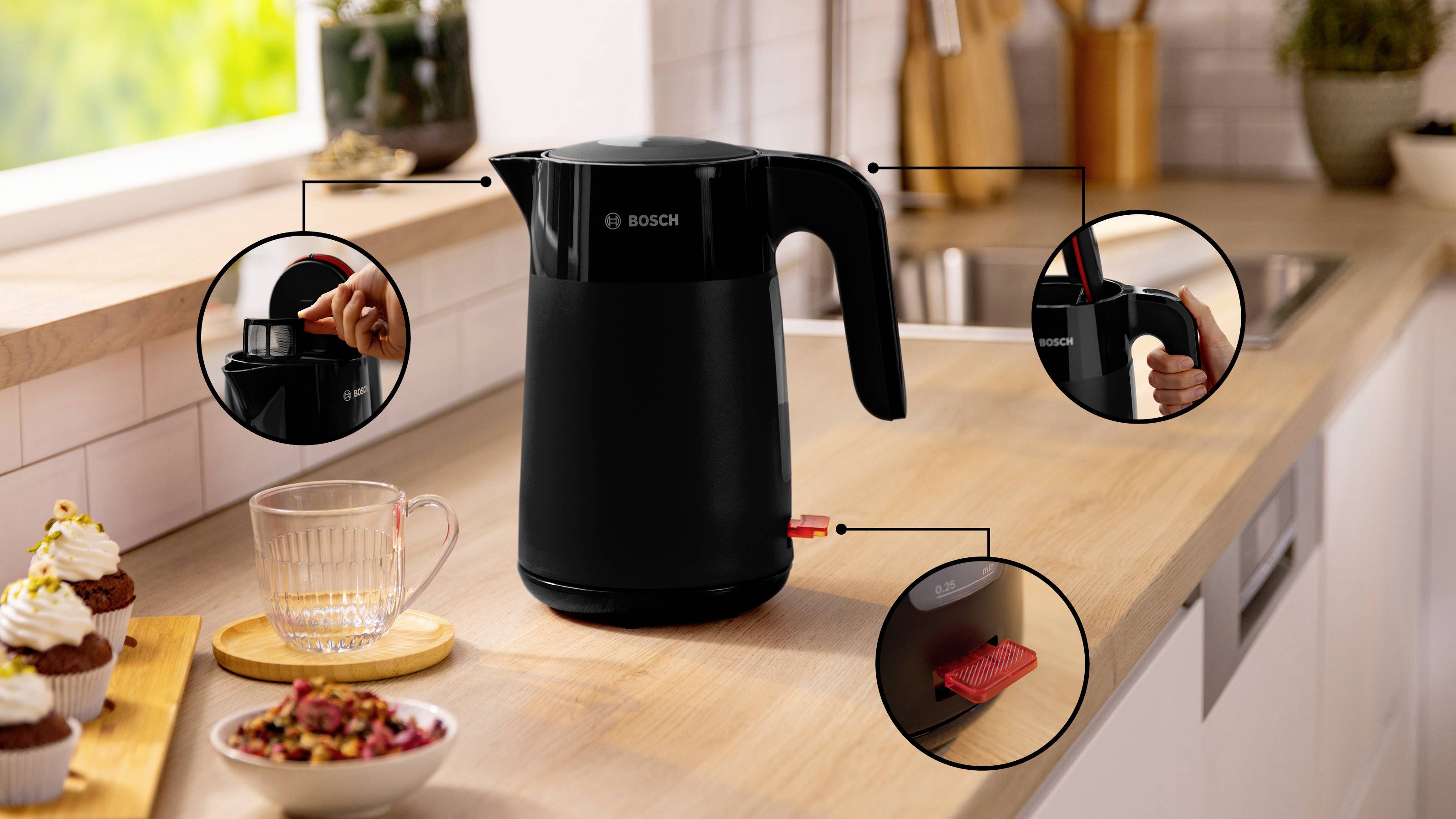 A black kettle on a kitchen counter with close-up insets showing its features: lid opening, handle with grip, and power button.