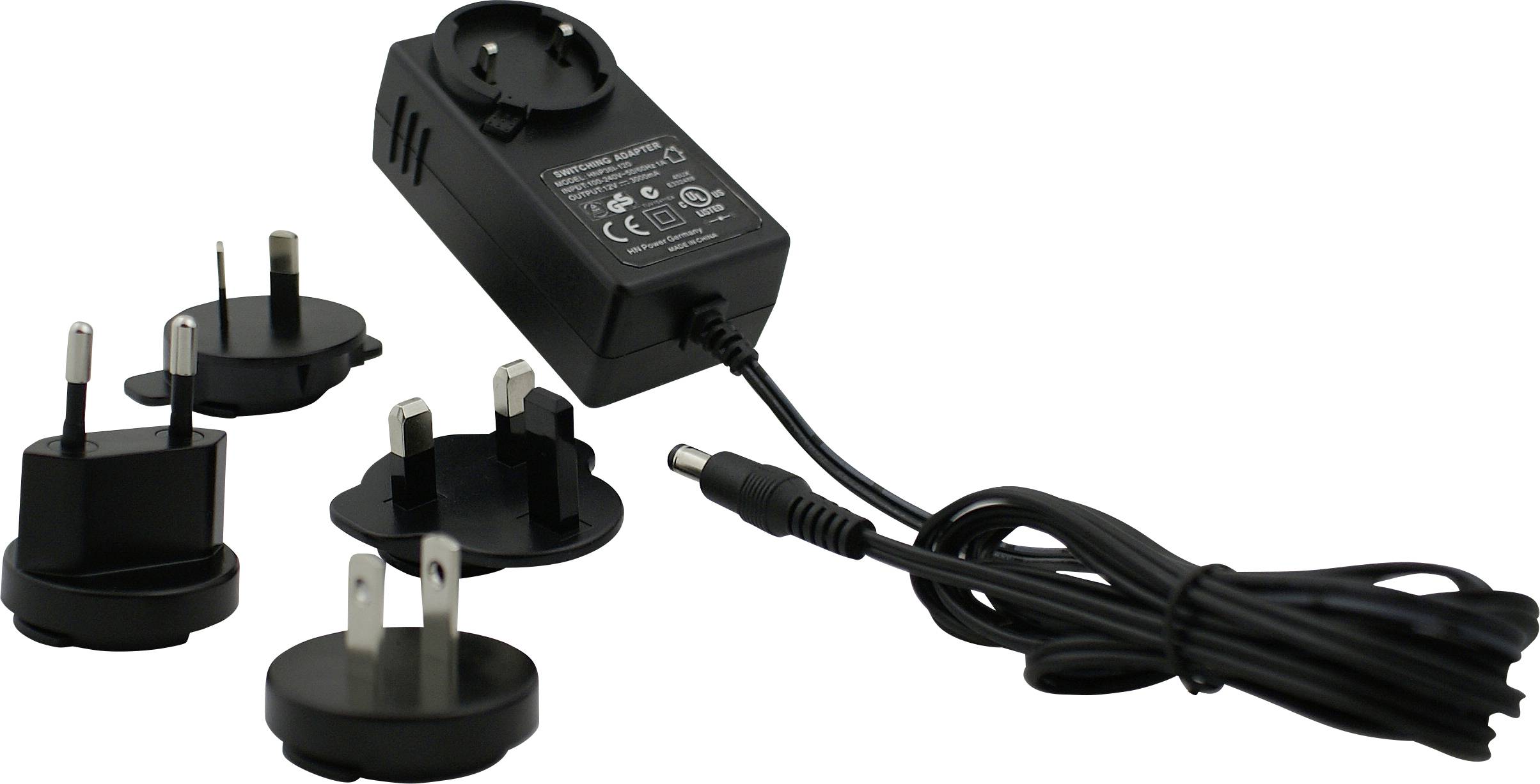 A black power adapter with multiple international plug attachments, including European, UK, and US styles, arranged around the adapter.