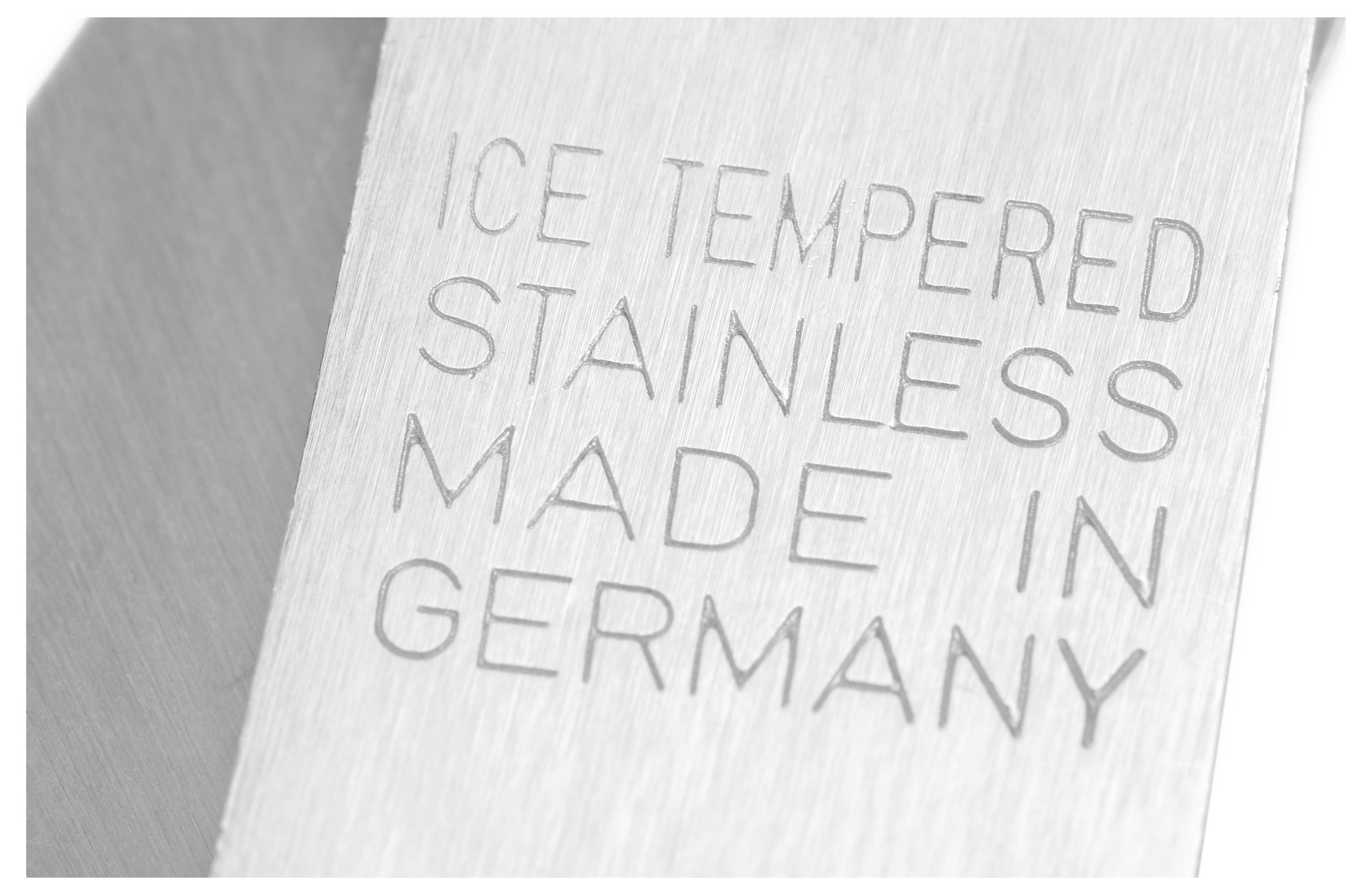Text etched on a metal surface reads 'ICE TEMPERED STAINLESS MADE IN GERMANY.'