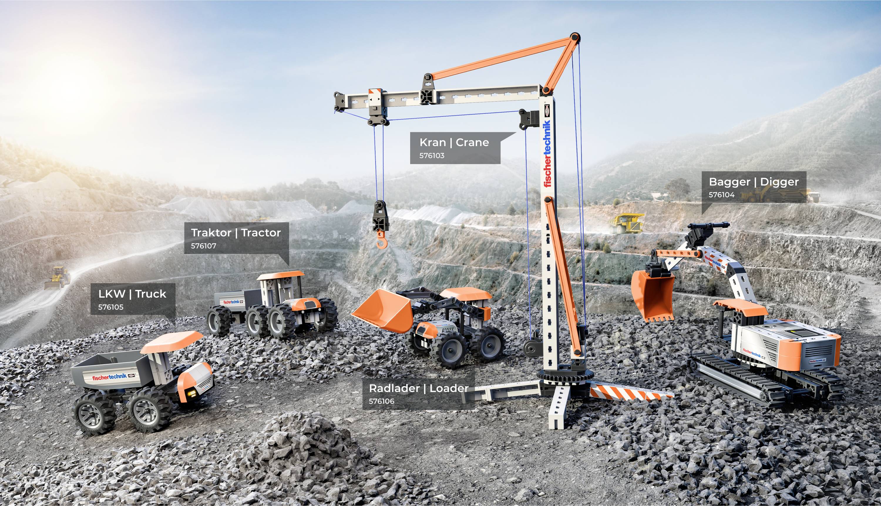 A quarry scene with toy construction vehicles labeled: crane, digger, truck, loader, and tractor, set on rocky terrain under a clear sky.