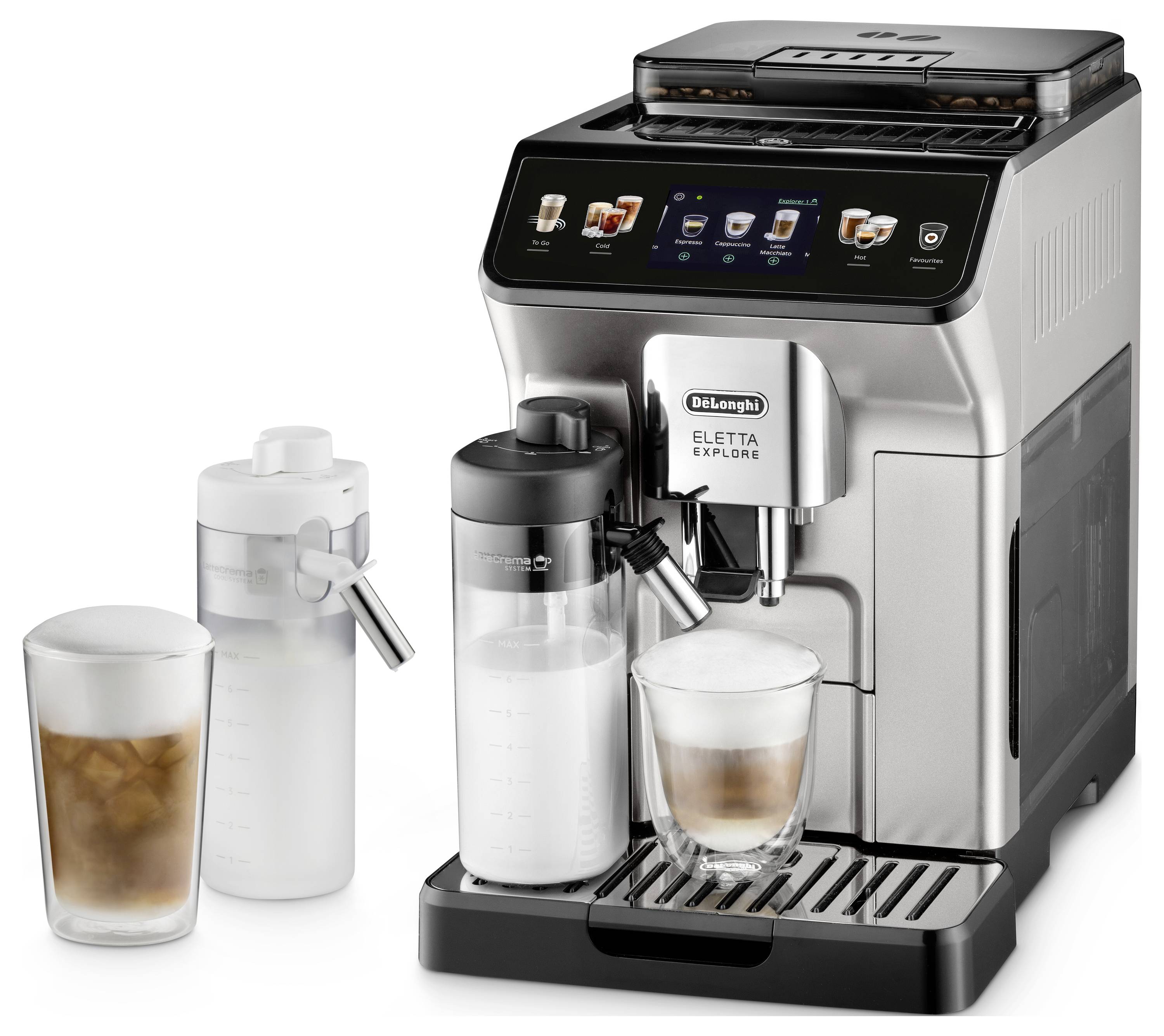 A silver espresso machine with a digital display, showing a latte being prepared. Two frothing carafes and an iced drink are nearby.