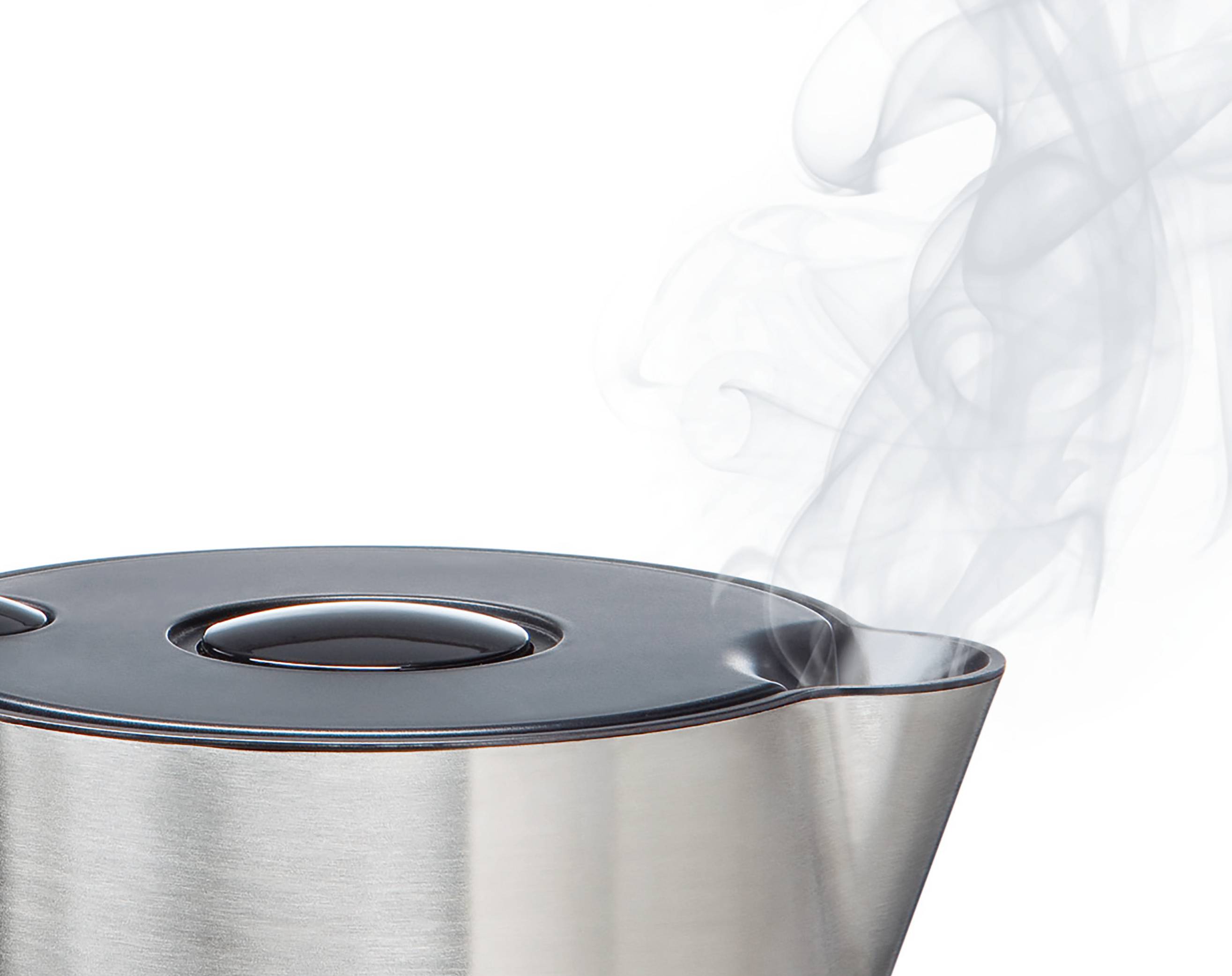 A close-up of a steaming kettle spout, emitting vapor, indicating boiling water inside. The kettle is made of stainless steel.