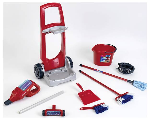 Set of red and gray cleaning toys including a vacuum, mop, broom, dustpan, bucket, and toy cleaning caddy on a white background.