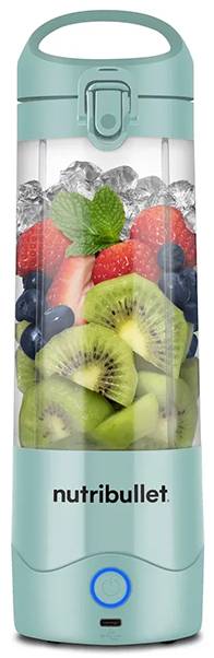 A portable blender filled with fresh strawberries, blueberries, kiwi slices, and ice, branded 'nutribullet'.