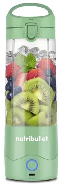 A green Nutribullet portable blender filled with fresh fruit slices and ice, including kiwis, strawberries, blueberries, and a mint leaf.