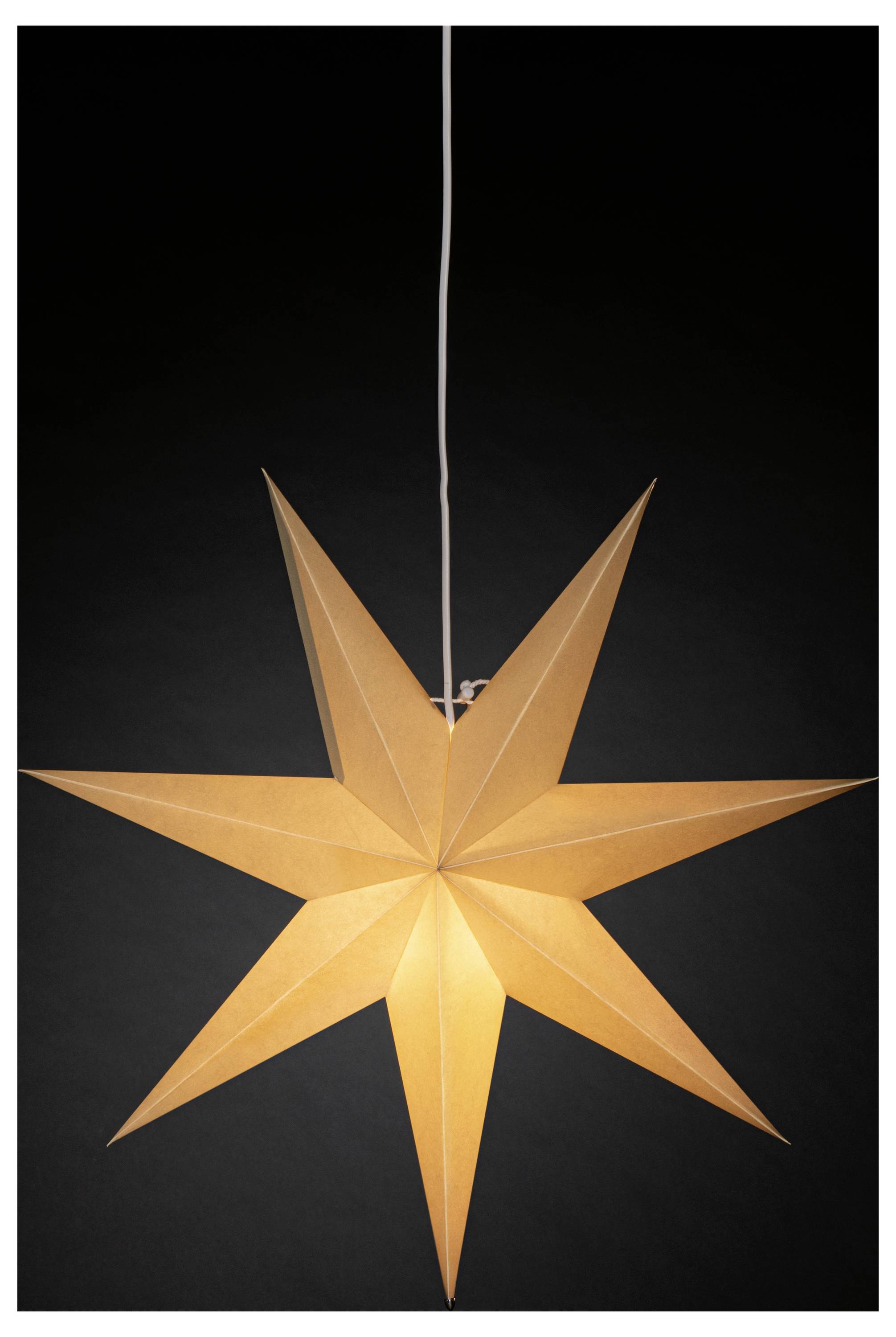 A glowing star-shaped pendant light with eight pointed tips hangs against a black background.