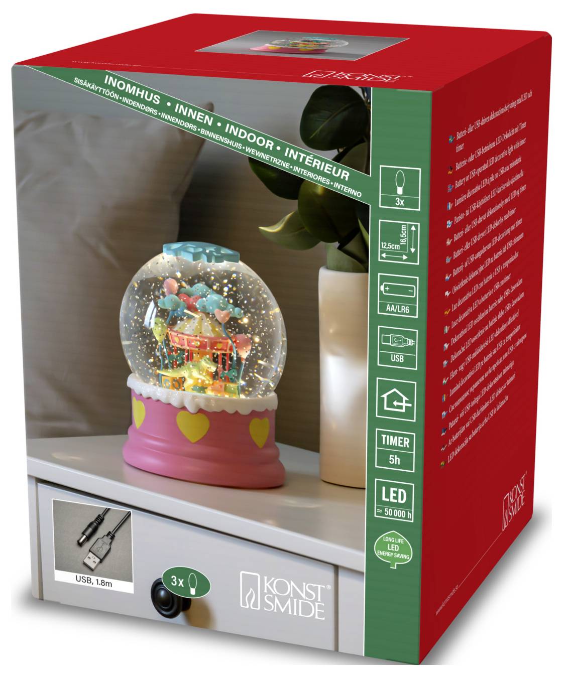 The image shows a boxed indoor LED snow globe lamp with timer, USB cable, and 3xAA battery compatibility. The packaging is red and features product details.