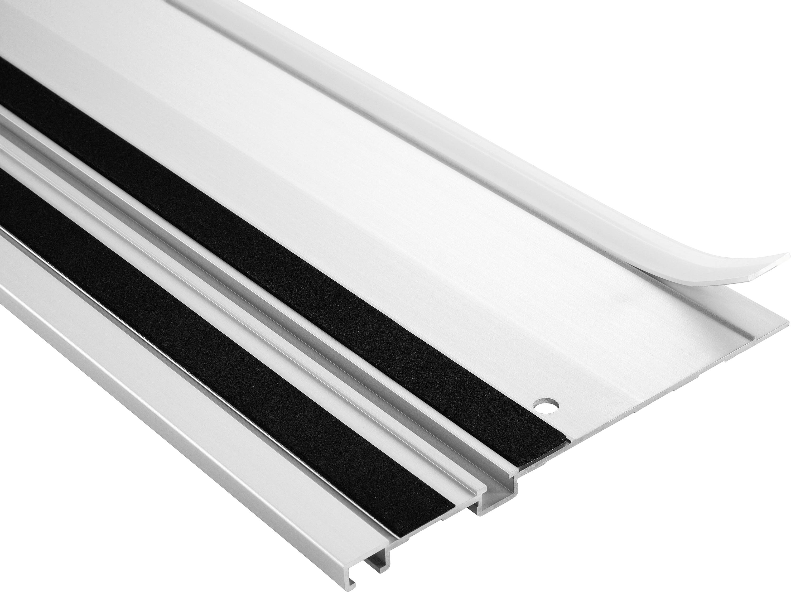 A close-up image of a silver metal threshold with black rubber strips, designed for under-door installation to improve insulation and reduce drafts.