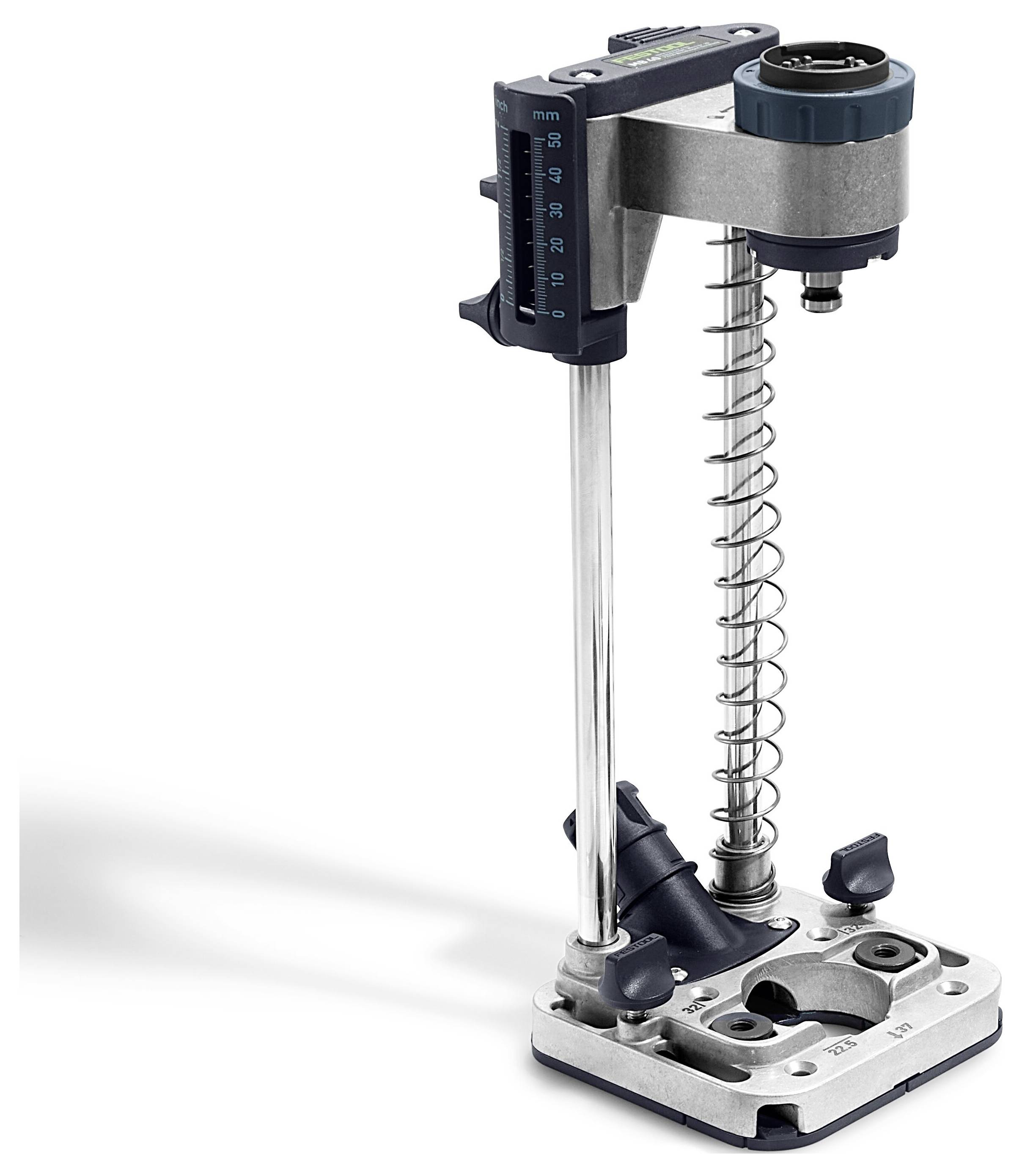A metallic drill guide tool with adjustable height, spring mechanism, and measurement scale, used for precise drilling in woodworking.