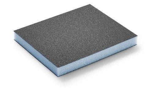 A rectangular abrasive sponge with a black textured surface and blue foam layer.