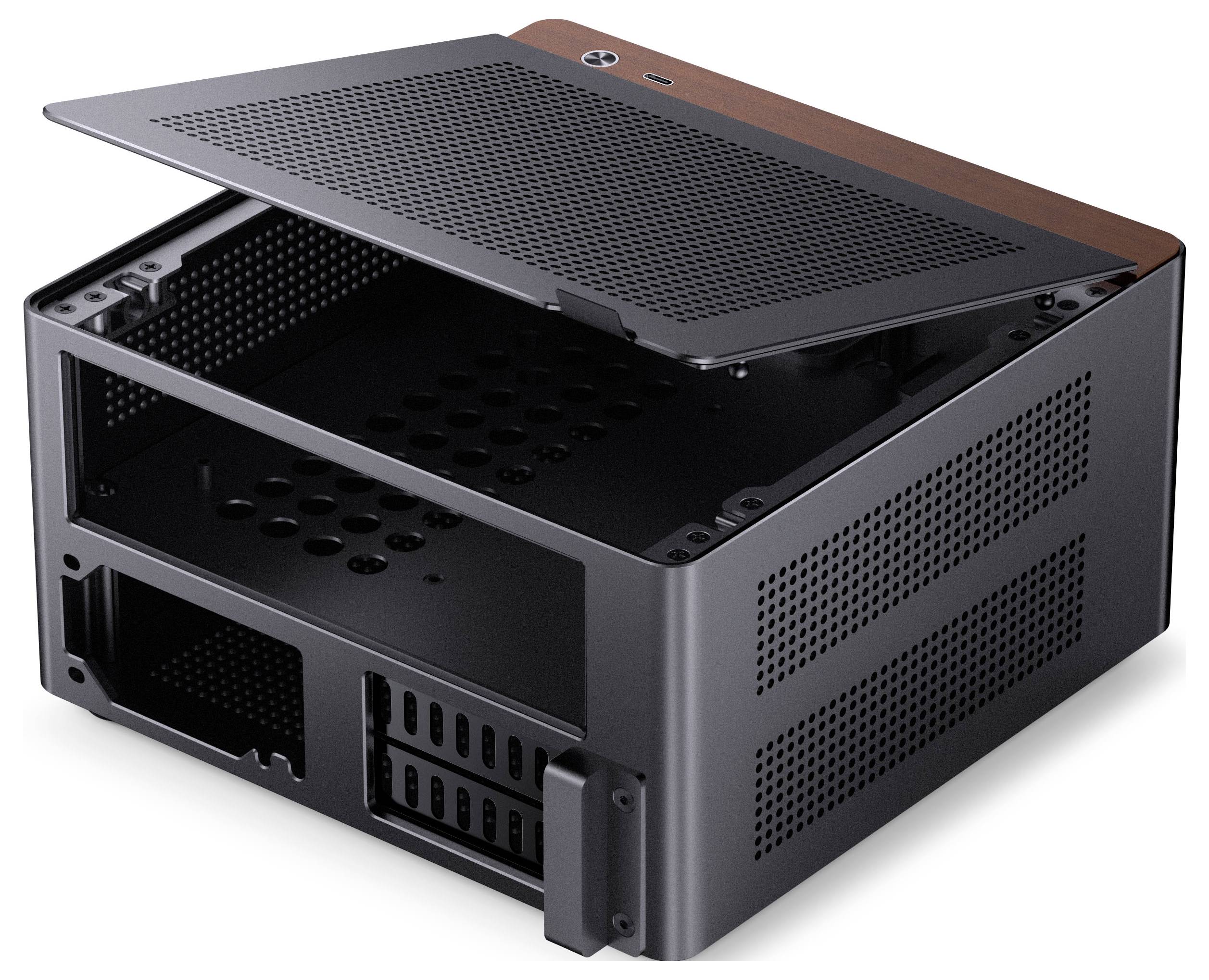 Small black desktop computer case with an open top panel, showing internal space for components; mesh design for airflow.