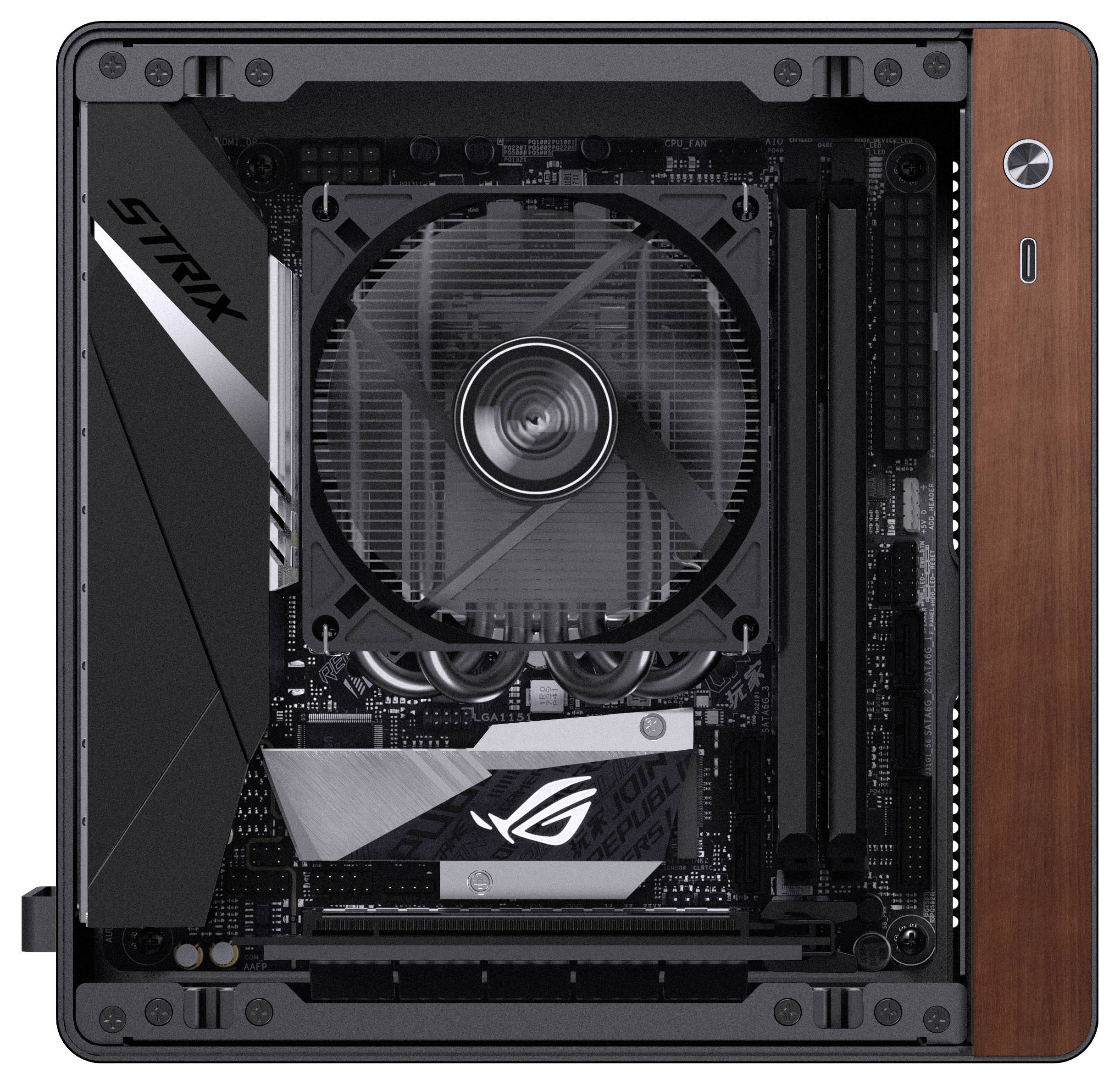 A compact computer case with a view of the motherboard, fan, and cooling system labeled 'STRIX.' The case has wooden side panel accents.