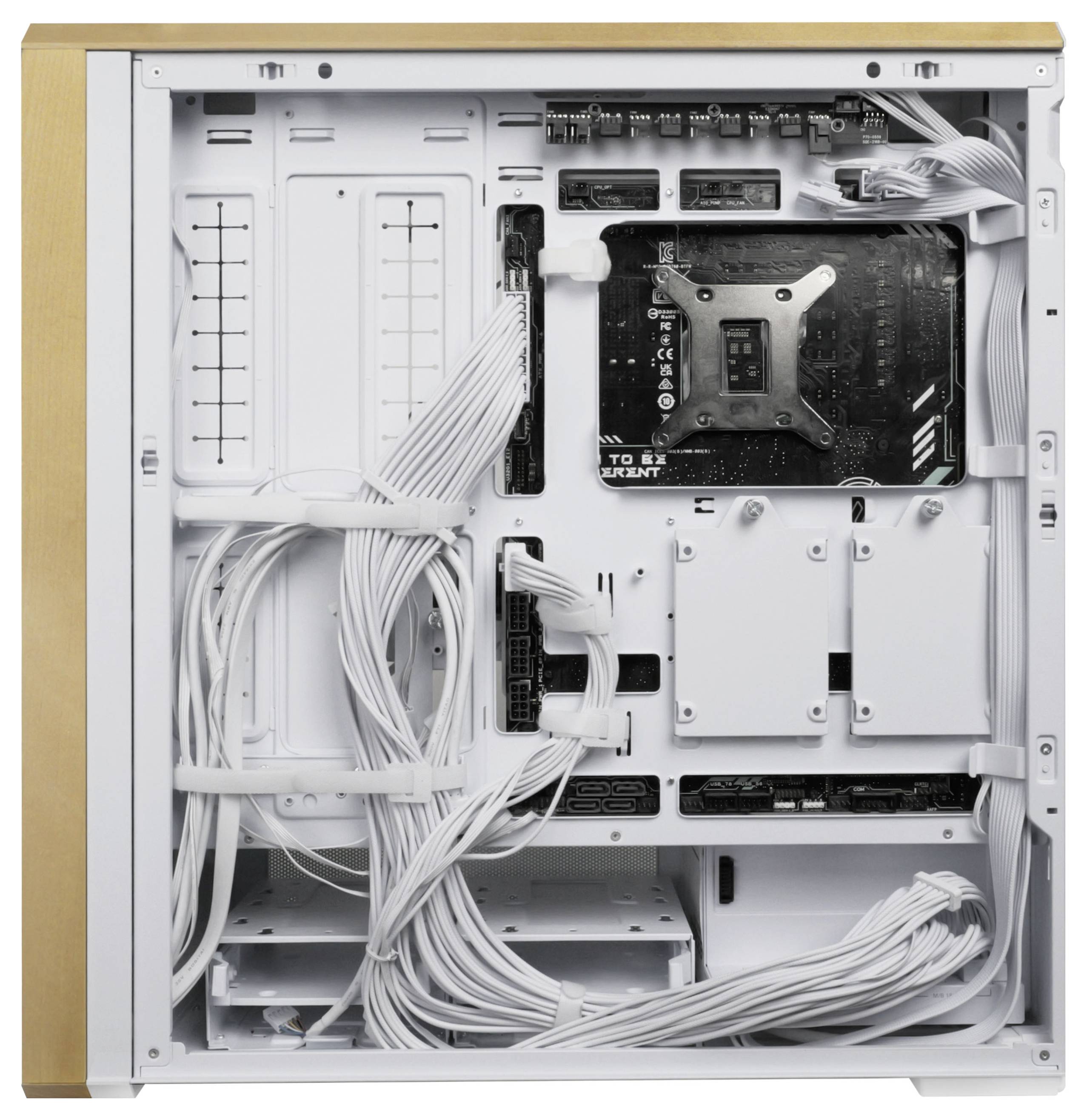 Inside view of a computer case showing a neat arrangement of cables, and a motherboard mounted on the right, with free slots for components.