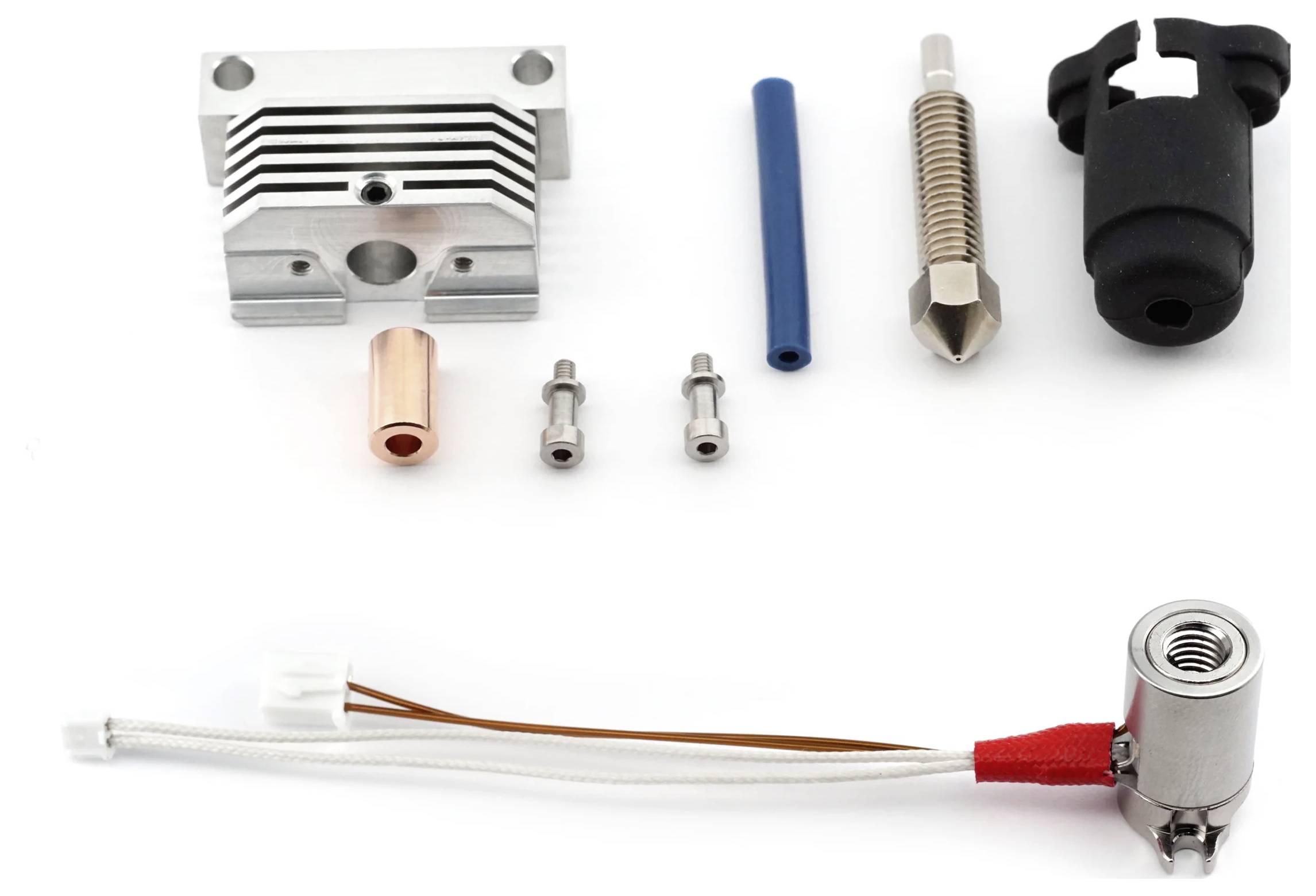 3D printer extruder kit with a metal heat sink, nozzle, thermistor, fan, and wiring. Components arranged for assembly.