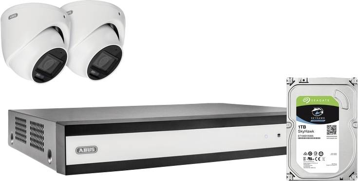 Home security system with two dome cameras, a central recording unit, and a Seagate SkyHawk 1TB hard drive for surveillance storage.
