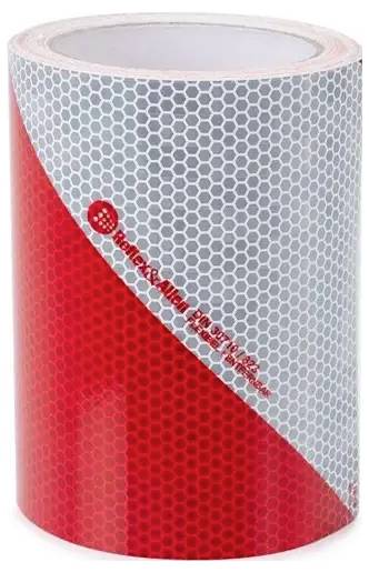 A roll of red and gray reflective tape with a hexagonal pattern, featuring text 'Reflexite' and a logo on the red section.