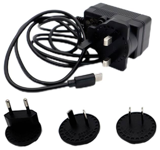 A black power adapter with a cable and three interchangeable plug types: UK, EU, and US, suitable for different international outlets.