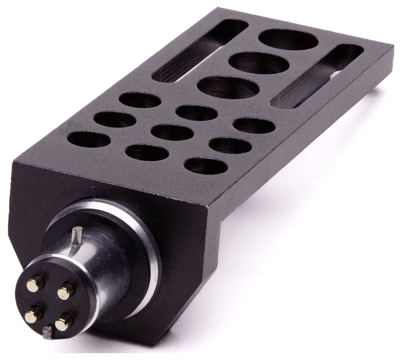 A black metal DJ headshell with circular cutouts and a connector at one end, used for attaching cartridges to turntable tonearms.