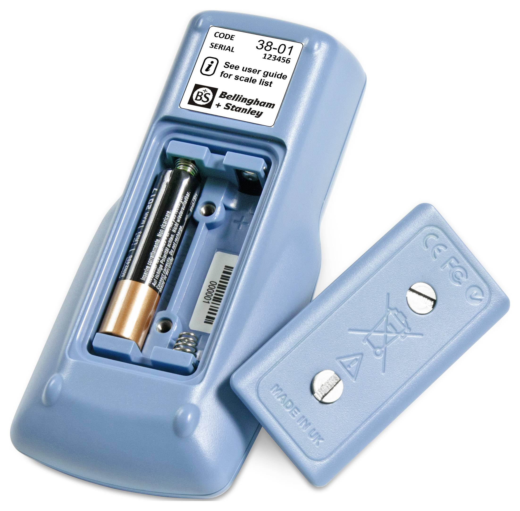 A blue electronic device with an open battery compartment showing two AA batteries inside. A label displays a serial number and brand information.