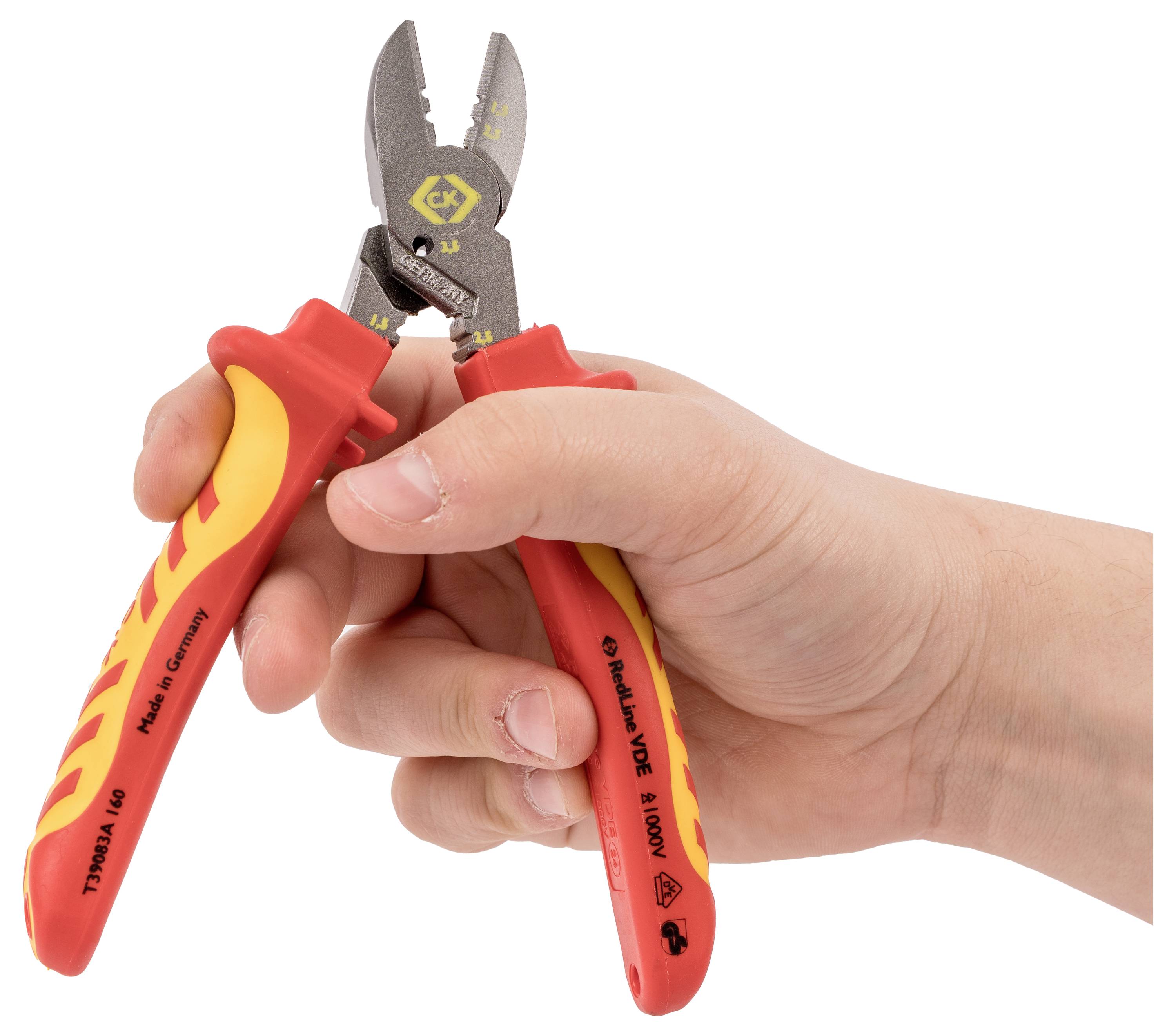A hand holding red and yellow pliers with a cutting edge, used for cutting wires; the handles are labeled with safety standards.