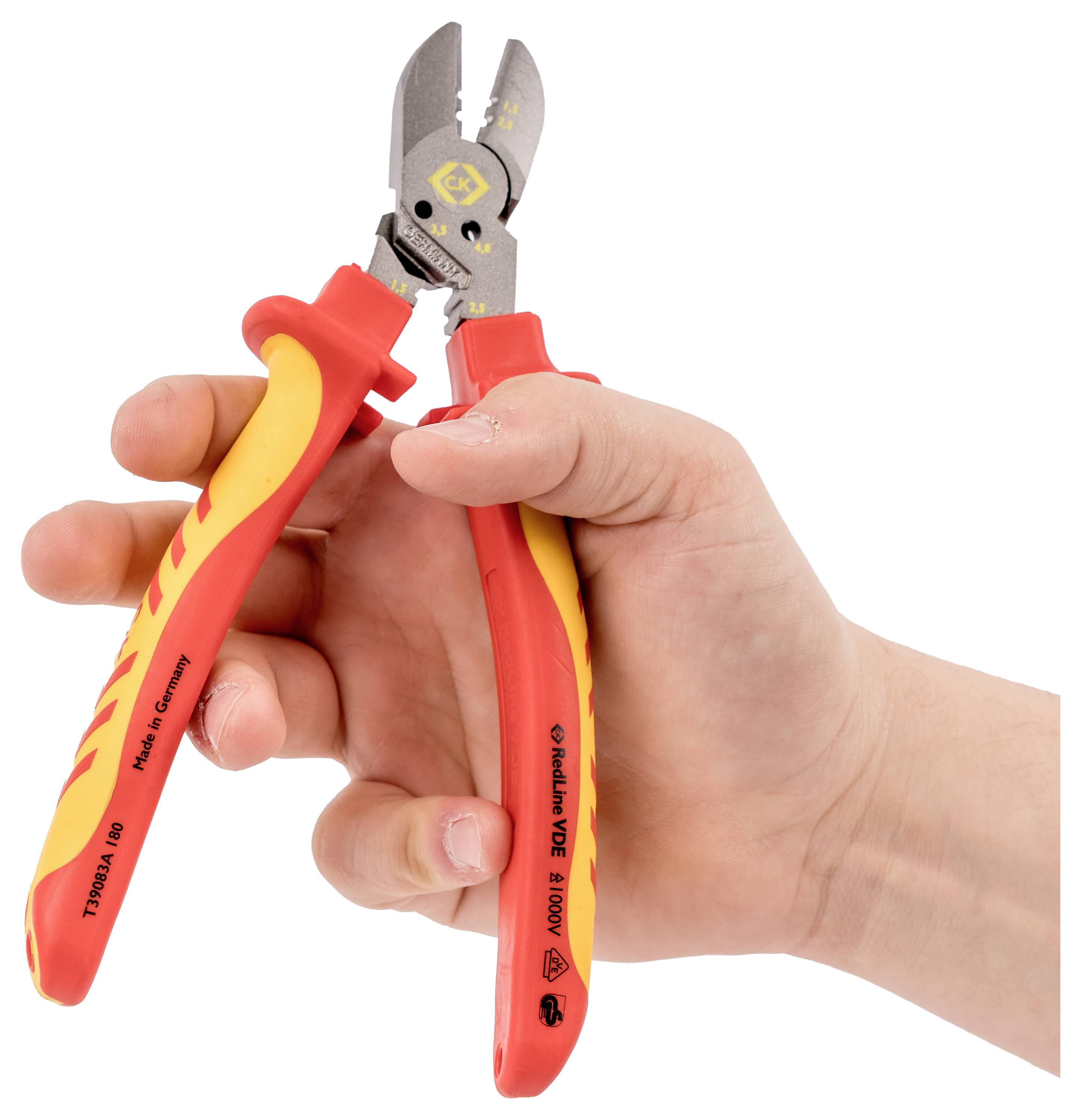 A hand holds insulated wire cutters with red and yellow handles, featuring a cutting blade and symbols indicating electrical safety compliance.
