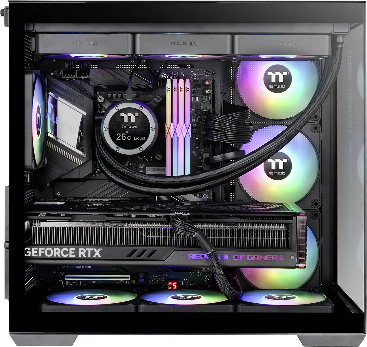 A computer case with RGB lighting displays internal components, including a large graphics card, cooling fans, and temperature readout.