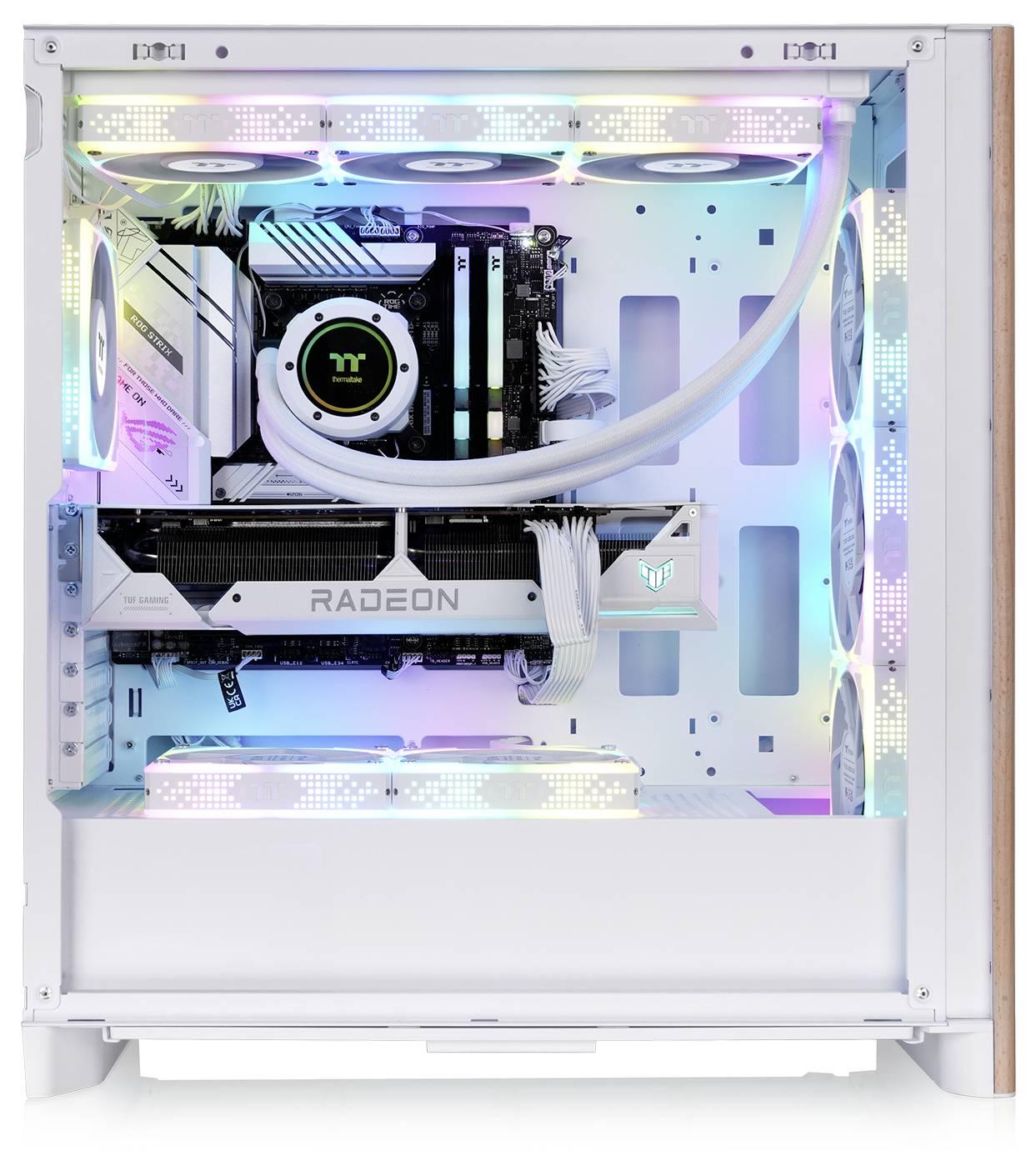 A computer with transparent side panel showcasing internal components, RGB lighting, and a 'RADEON' graphics card in a white case.