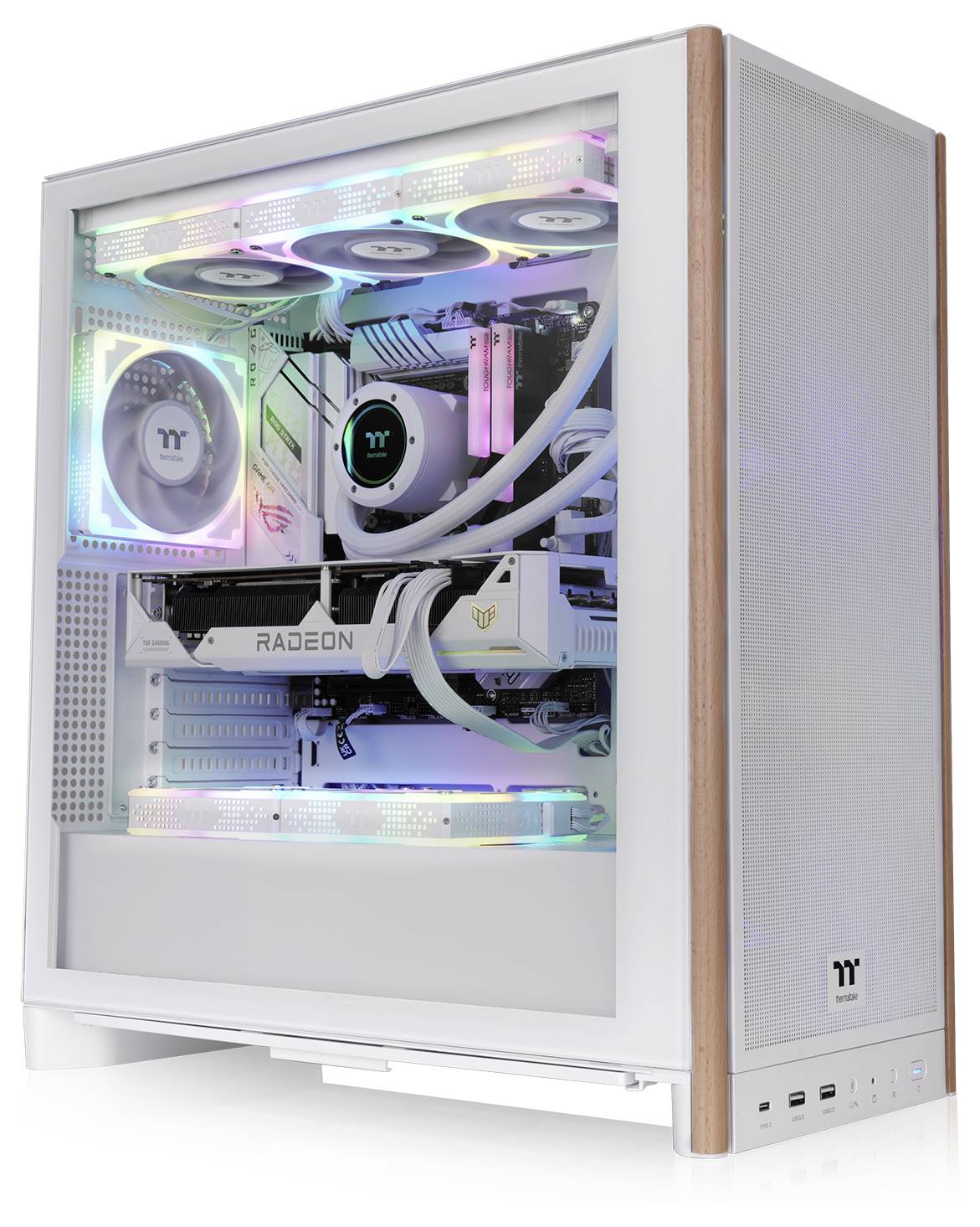 A white gaming PC case with RGB lighting inside, showcasing components like fans, a graphics card labeled 'Radeon,' and a cooling system.