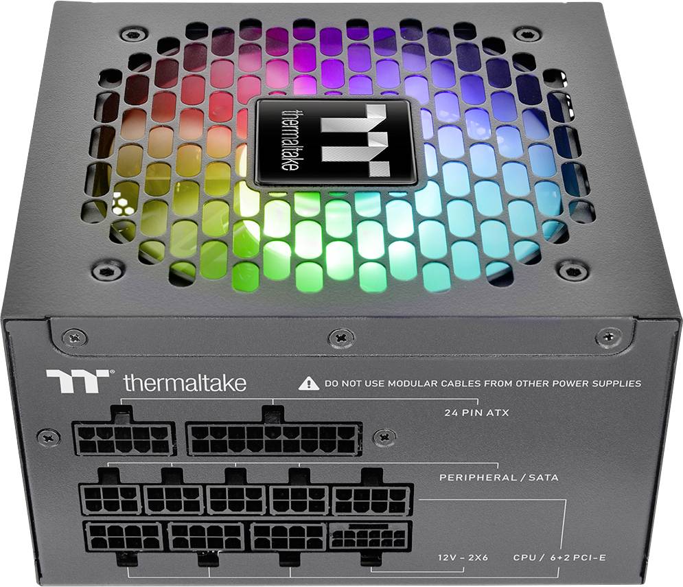 A computer power supply unit by Thermaltake, with RGB lighting visible through a mesh grille, featuring multiple cable connection ports.