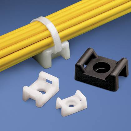 A black cable clamp and three white mounts are displayed alongside yellow cables on a blue surface, illustrating cabling solutions.