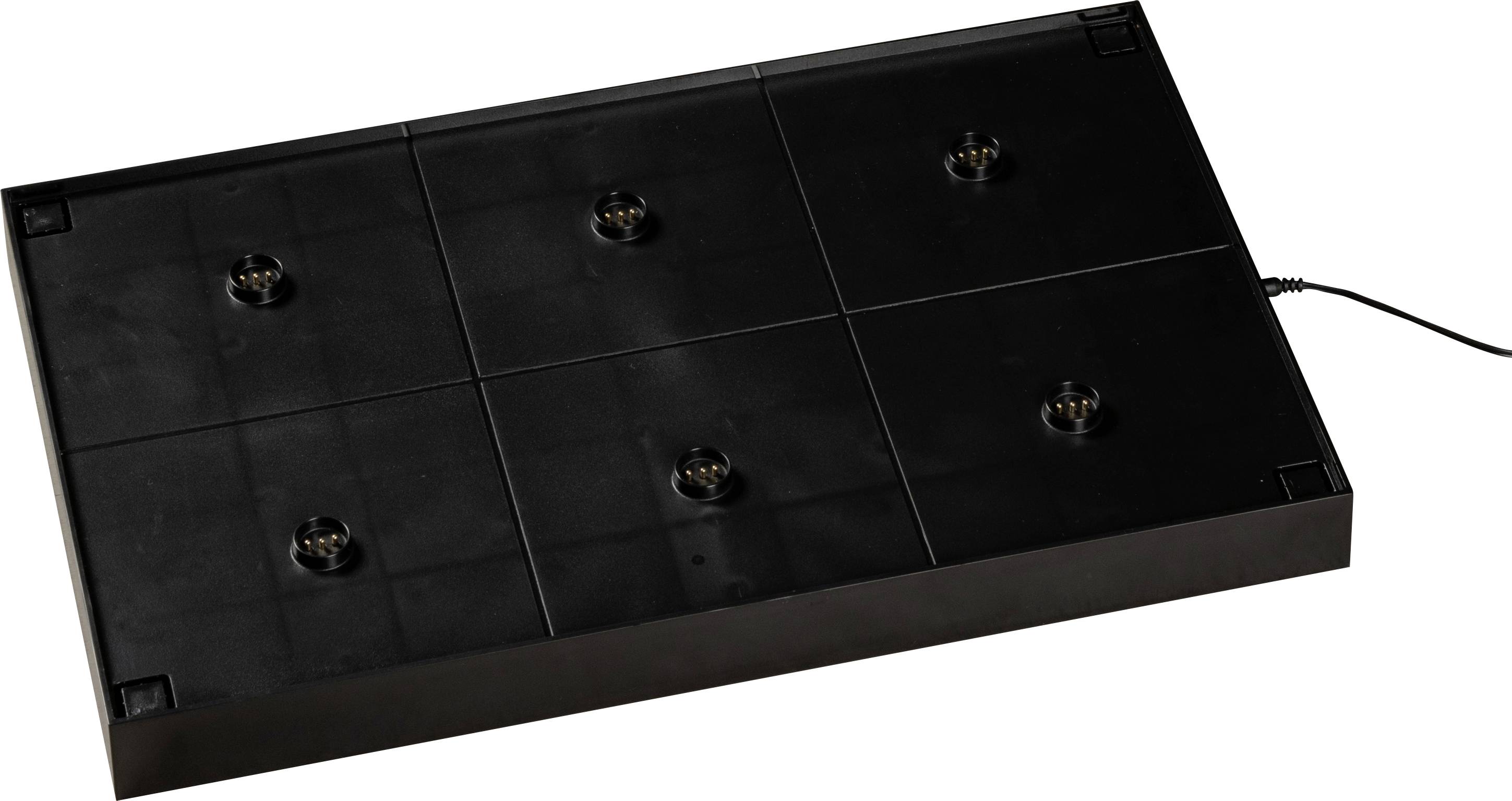 A black rectangular electronic device with six protruding connectors, possibly a charging station, with a cable on the right side.