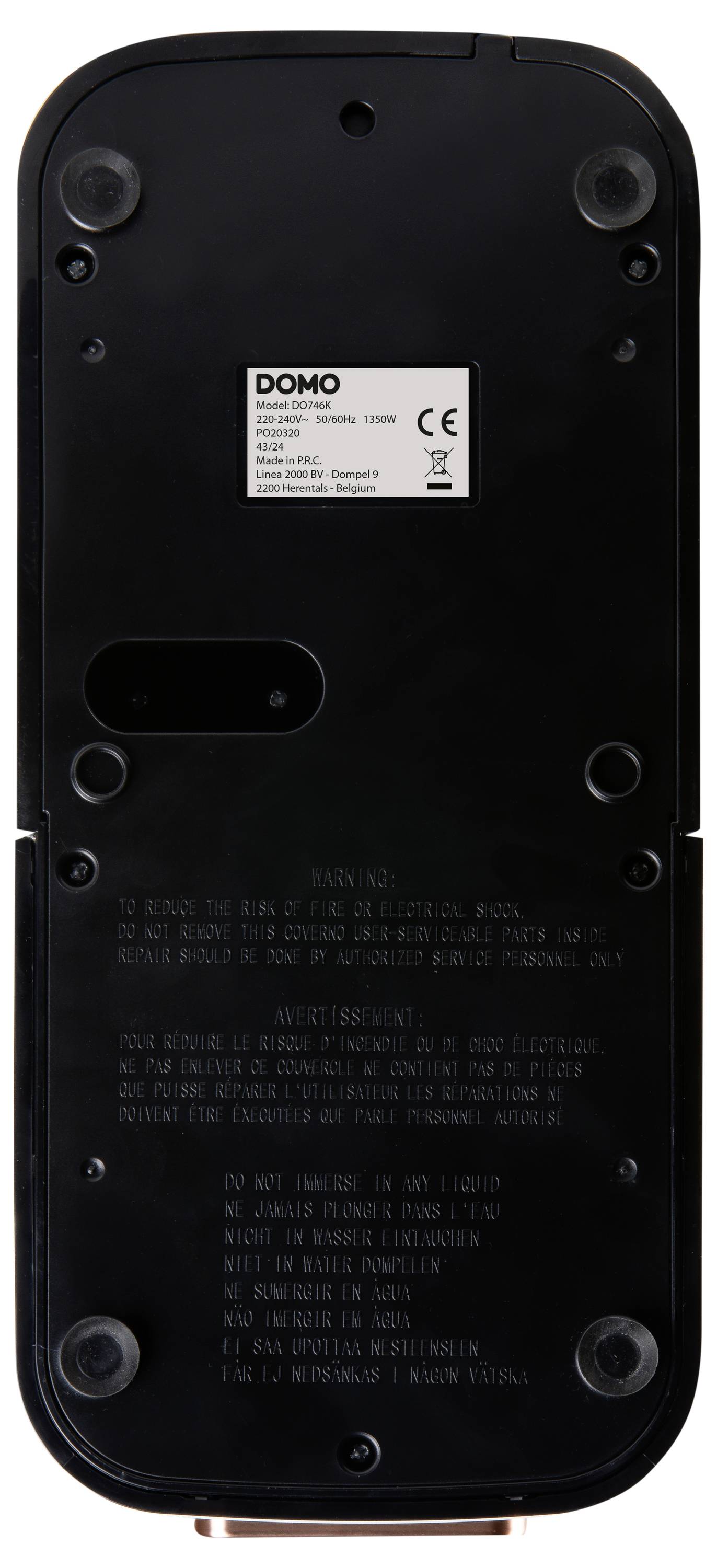 Black rectangular electronic device with label showing compliance markings and warnings. Four rubber feet are at the corners for stability.