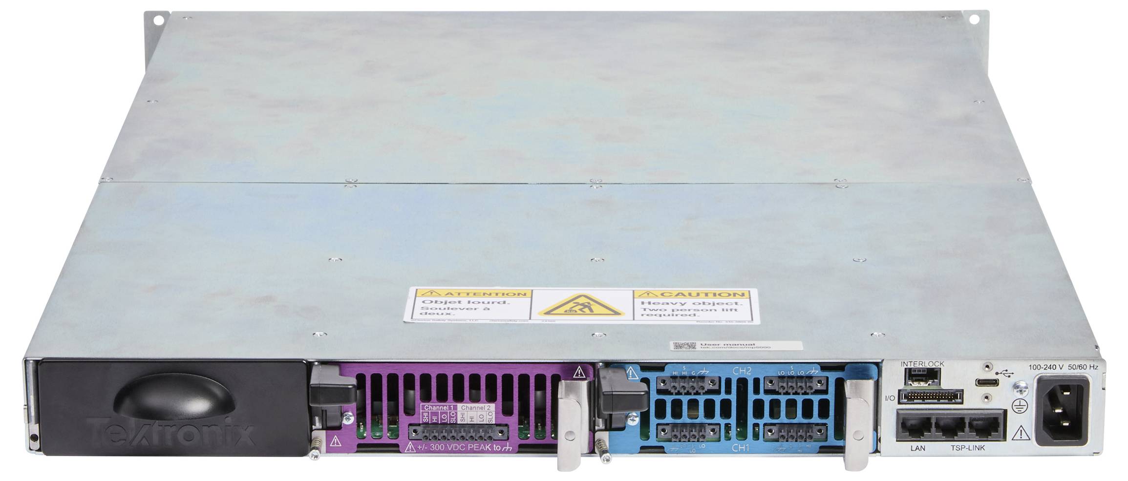 A metal device with multiple colored slots, power connections, and labeled ports. Safety warning stickers are visible on the top panel.